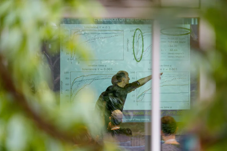 Man pointing at a presentation on a screen
