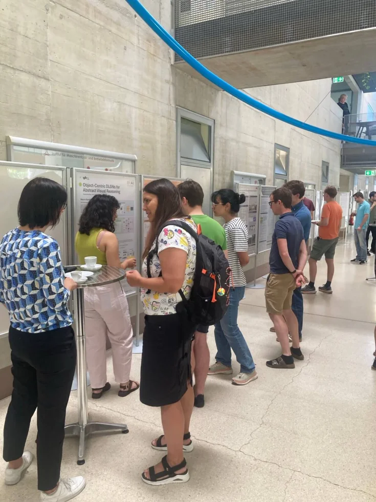 People looking at posters at ELLIS Unit Graz