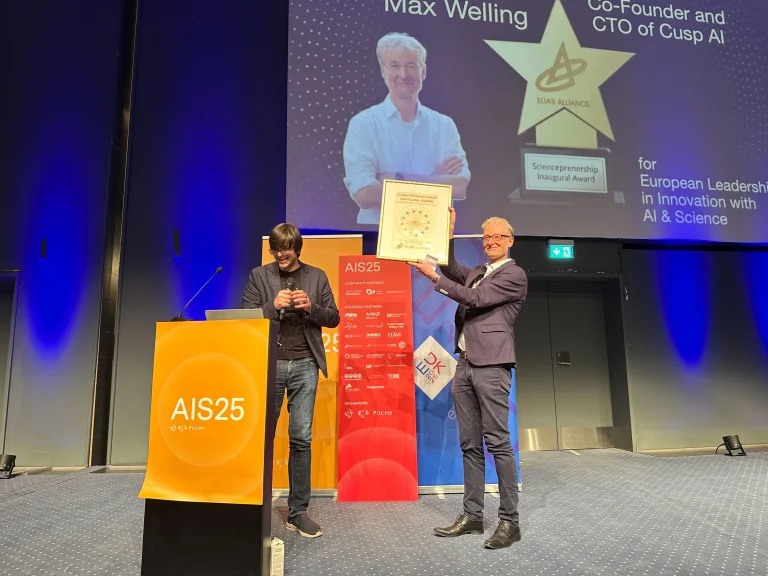 Max Welling, ELLIS Fellow and ELLIS Co-Founder, accepts the first Sciencepreneurship Award from ELIAS on the stage with Matthias Bethge