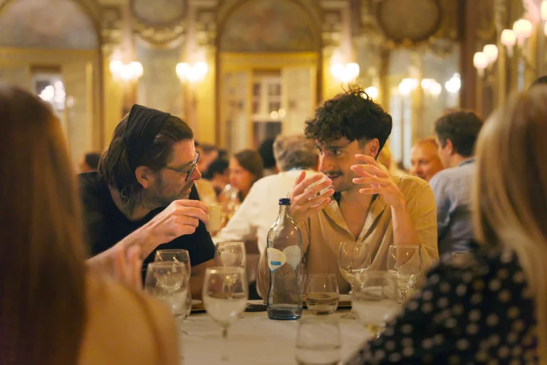 Matthias Bethge and a student at the Gala Dinner at the ELLIS Doctoral Symposium 2026 in Lisbon