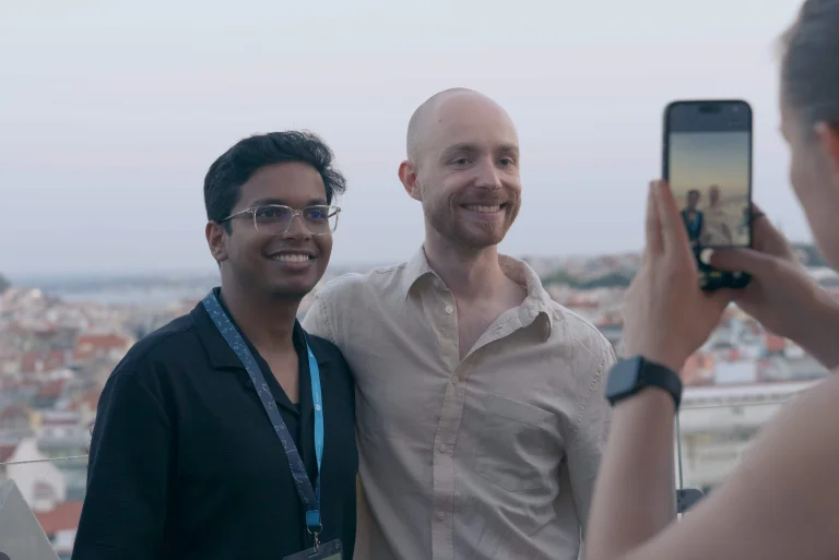 Students at the rooftop social event at the ELLIS Doctoral Symposium 2026 in Lisbon