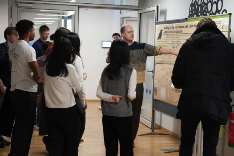 ELLIS Pre-NeurIPS Fest 2025: Institute Tuebingen, people looking at posters