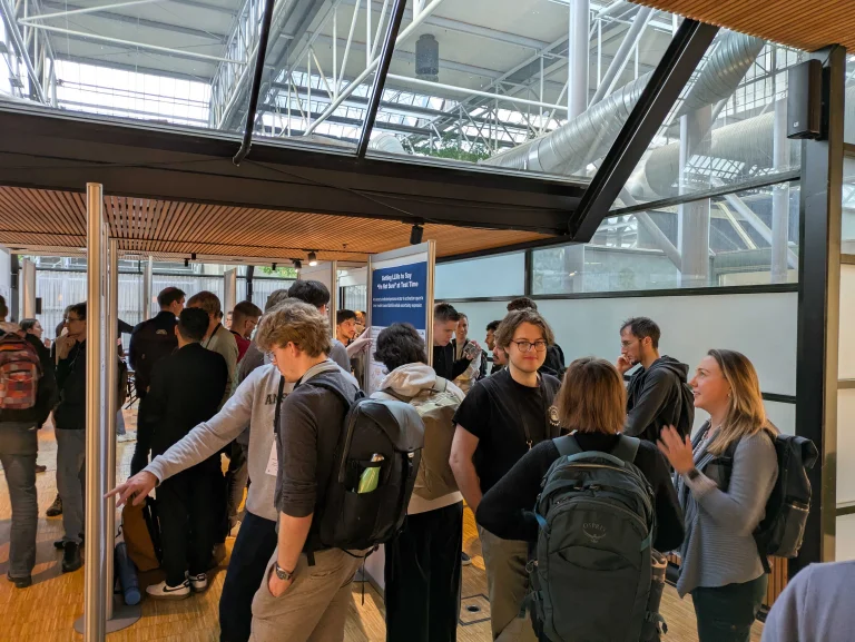 Many people attending a poster session of an UnConference workshop