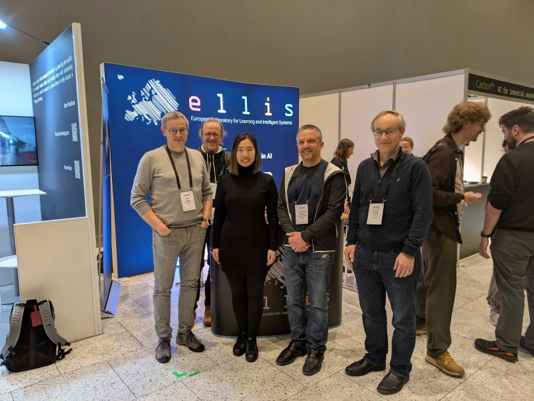 ELLIS-affiliated researchers visiting the ELLIS booth, including Bernt Schiele, Bernhard Schölkopf, Zhijing Jin, Serge Belongie and Andreas Krause.