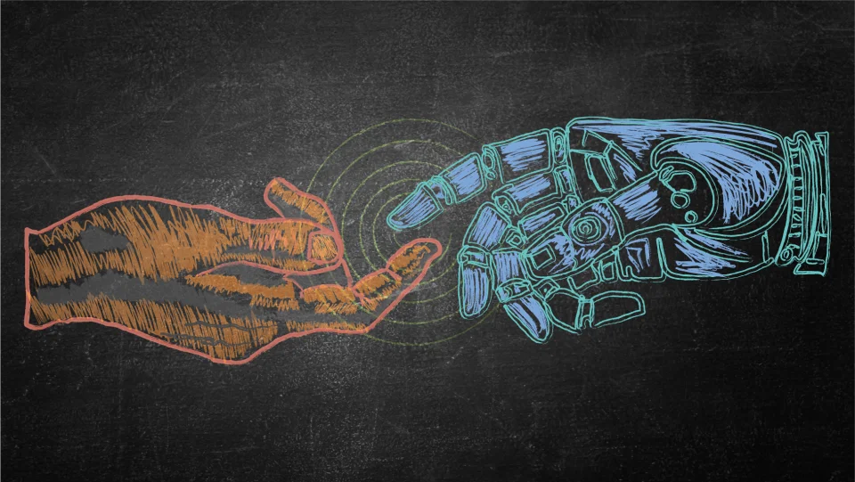 Chalk drawing of an orange hand and a blue-green robot hand