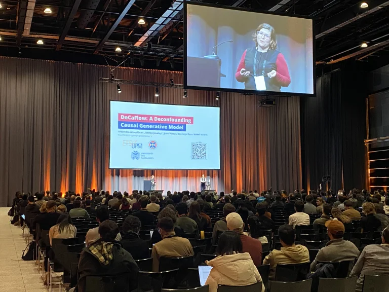 Isabel Valera presents a talk at EurIPS in Copenhagen