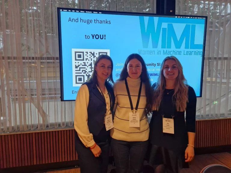 Stella Graßhof, Giulia Clerici and Ana Lucic at the WiML Workshop at EurIPS.