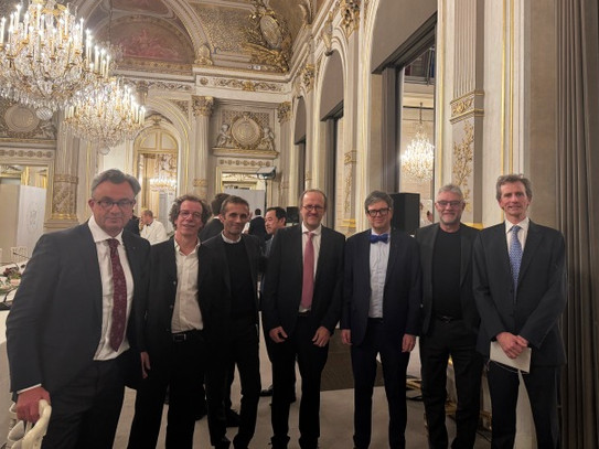 Group of 7 men in suits at a French palace for the AI Action Week in Paris